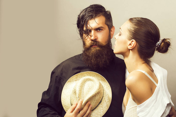 young stylish sexy couple with hat - 写真・画像