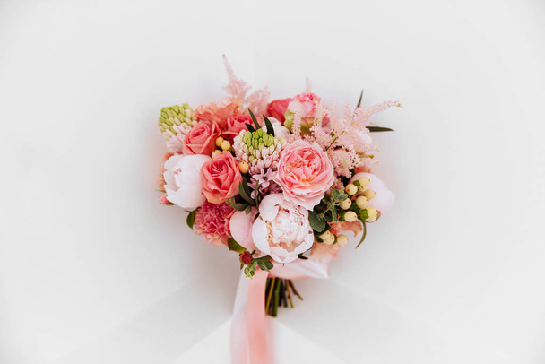 Wedding flowers, bridal bouquet closeup. Decoration made of roses, peonies and decorative plants, close-up, white background. copy spase - Foto, immagini