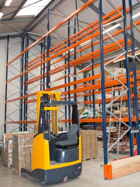 Forklift loading pallet for transport business delivery Shelves in Distribution Warehouse - Photo, Image