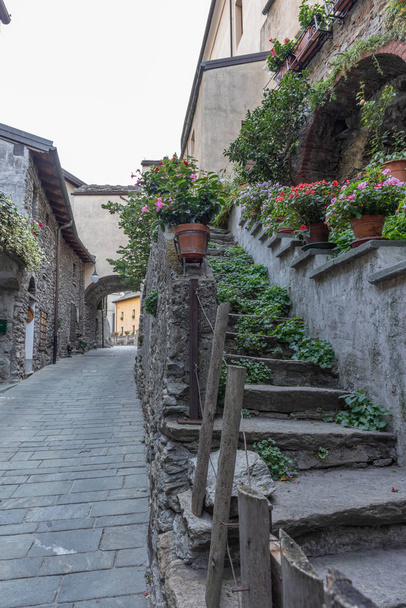 Alley in the mountain village in Bard, vertical image - Photo, Image