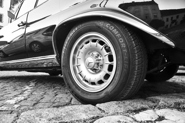 Mercedes Benz logo on vintage car wheel. Semperit logo on tyre. Mercedes-Benz is a German automobile manufacturer. The brand is used for luxury automobiles, buses, coaches and trucks. Black white - Photo, Image
