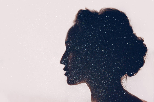 Girl and space. Silhouette and starry sky. - Foto, Bild