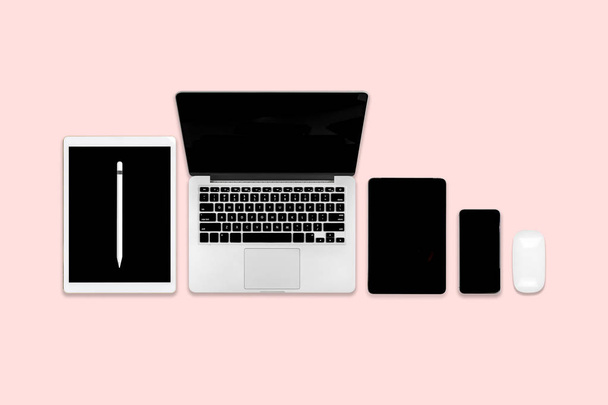 Flat lay photo of office table with laptop computer, digital tablet, mobile phone and accessories. on modern background. Desktop office mockup concept. - Photo, Image