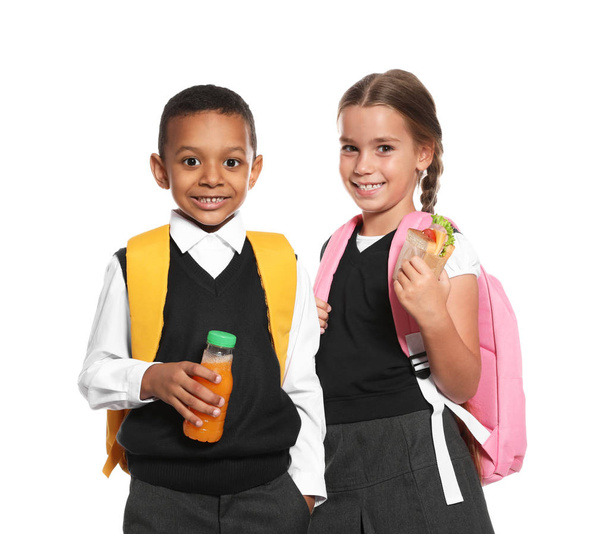 児童の在籍する健康食品と白い背景のバックパック - 写真・画像