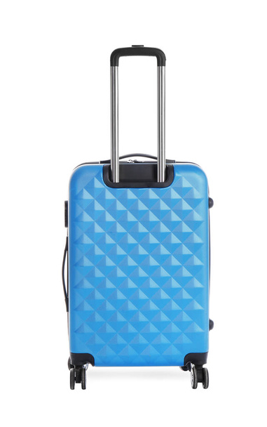 Blue suitcase for travelling on white background - Valokuva, kuva