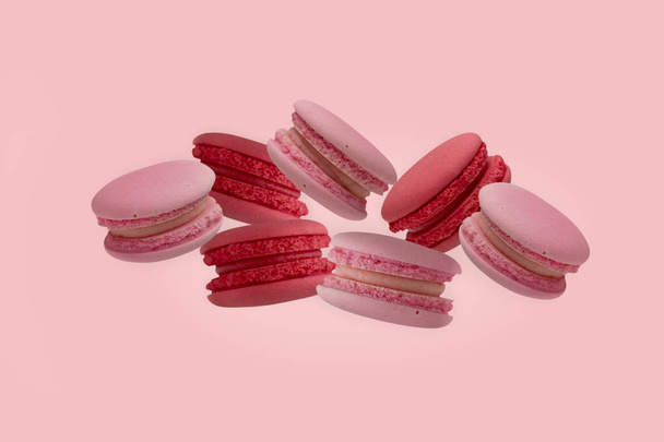 colorful macaroons on the pink background. - Фото, изображение