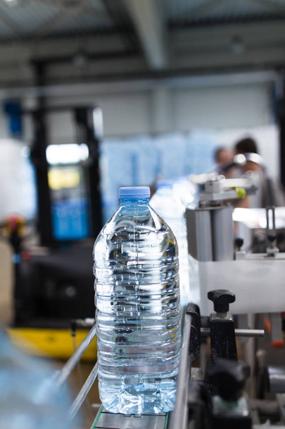 Bottling plant - Water bottling line for processing and bottling pure mineral carbonated water into bottles and gallons. - 写真・画像