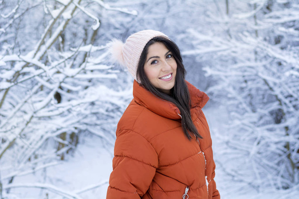 Beautiful Smiling Young Woman in a Winter Snowy Forest .Winter Holidays - Φωτογραφία, εικόνα