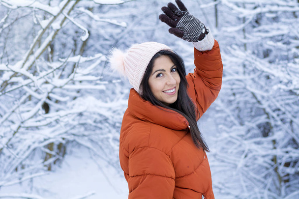 Beautiful Smiling Young Woman in a Winter Snowy Forest .Winter Holidays - Fotó, kép