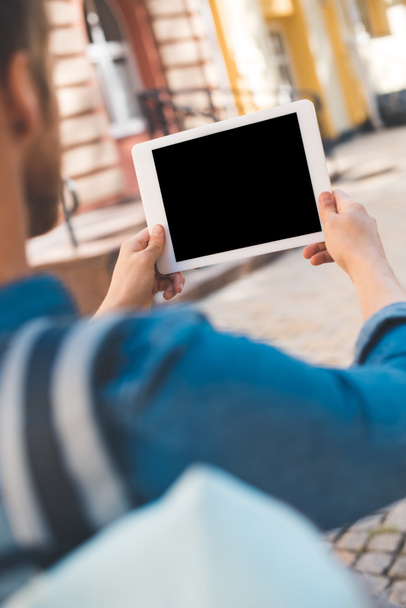 cropped shot of man using tablet with blank screen on street - Foto, Bild