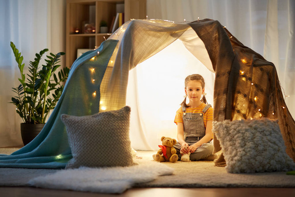 little girl with toys in kids tent at home - Photo, Image