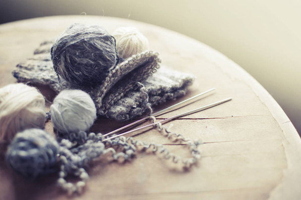 closeup view of knitting needles and yarn over wooden table - Foto, immagini