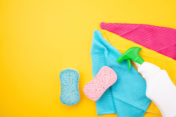 Detergents and cleaning accessories in pastel color. Cleaning service, small business idea, spring cleaning concept. Flat lay, Top view. - Photo, Image