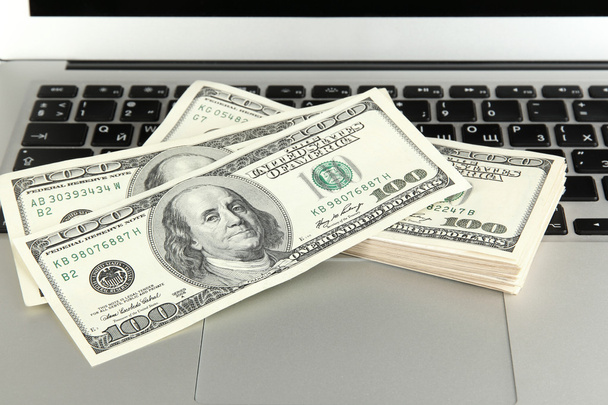 Money on laptop close-up - Fotó, kép