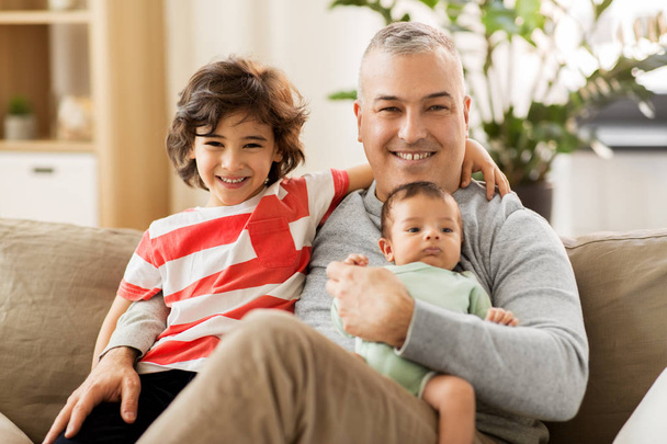 happy father with preteen and baby son at home - Photo, Image