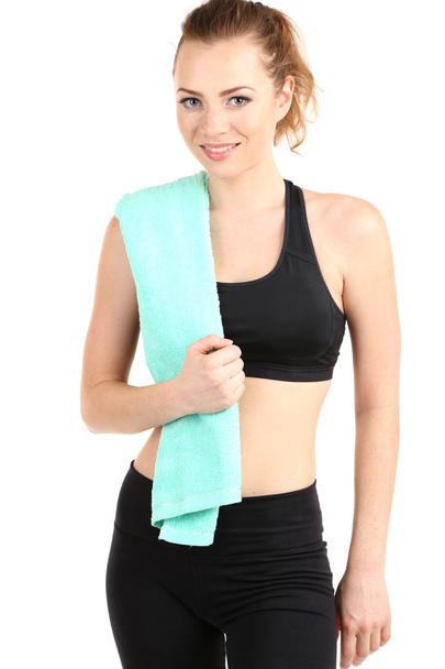 Young woman with towel after workout isolated on white - Фото, изображение