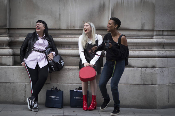 LONDON, United Kingdom- SEPTEMBER 14 2018: People on the street during the London Fashion Week - Фото, изображение
