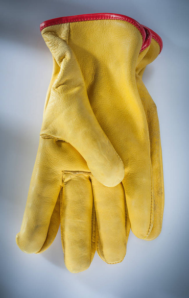 Leather safety gloves on white background. - 写真・画像