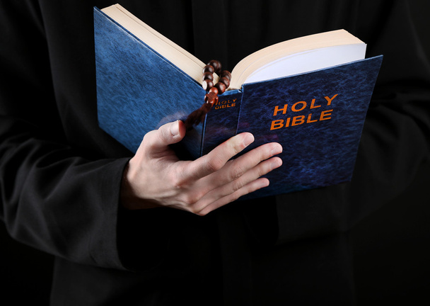 Priest reading from the holy bible, close up - Photo, image