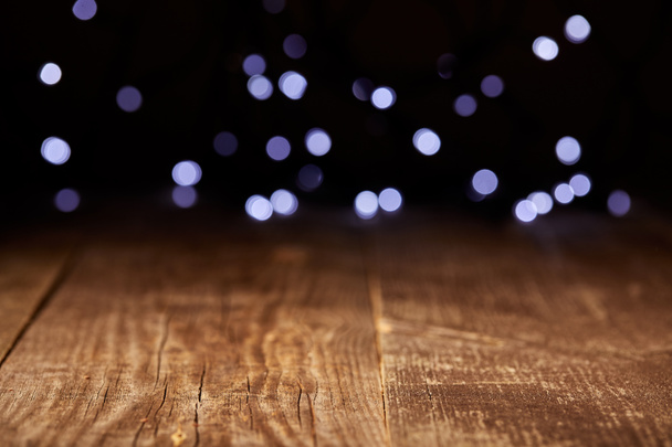 close up view of wooden tabletop and defocused bokeh lights backdrop - Photo, Image