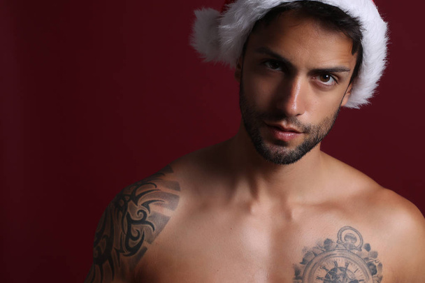 Sexy man wearing hat of santa claus   - Foto, immagini