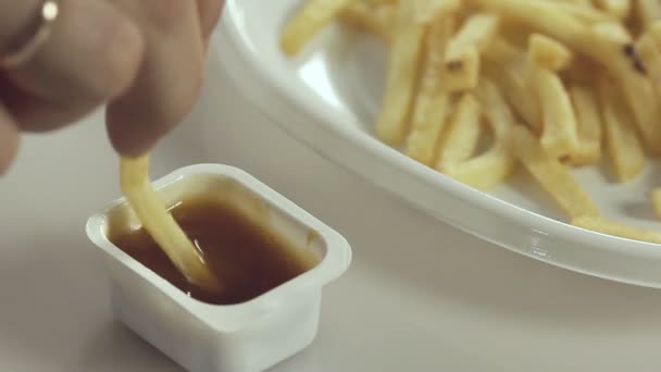 Man eats french fries - Filmmaterial, Video