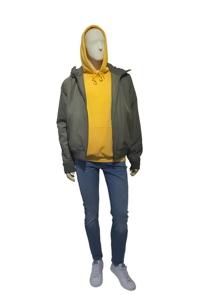 Full-length male mannequin dressed in jacket, hood sweatshirt and blue jeans, isolated on white background. No brand names or copyright objects. - Photo, Image
