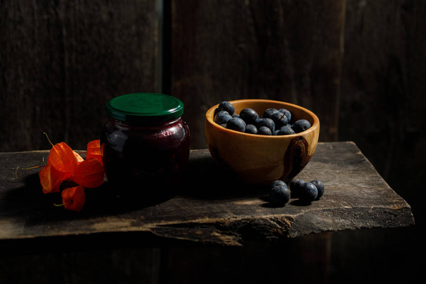 Autumn harvest. Berries of plum and physalis. Rustic. - Photo, Image