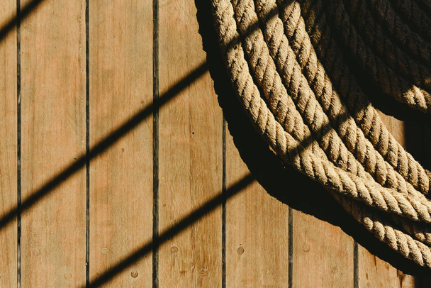 Large rolled-up boat dock with dark background. - Fotó, kép