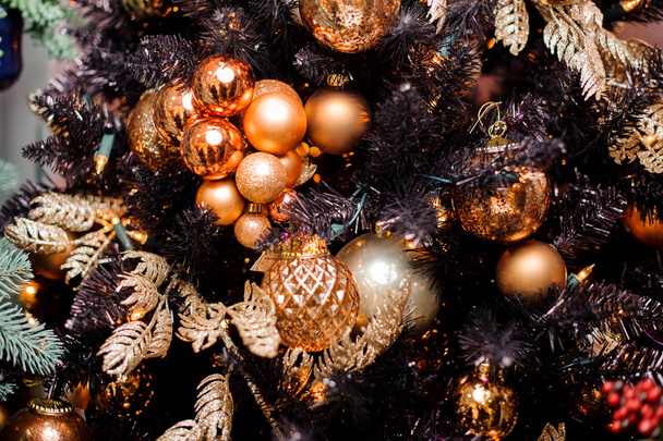 Background of christmas tree decorated with golden toys - Zdjęcie, obraz