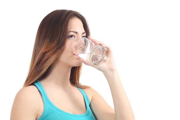 Woman drinking water from a glass - Фото, зображення