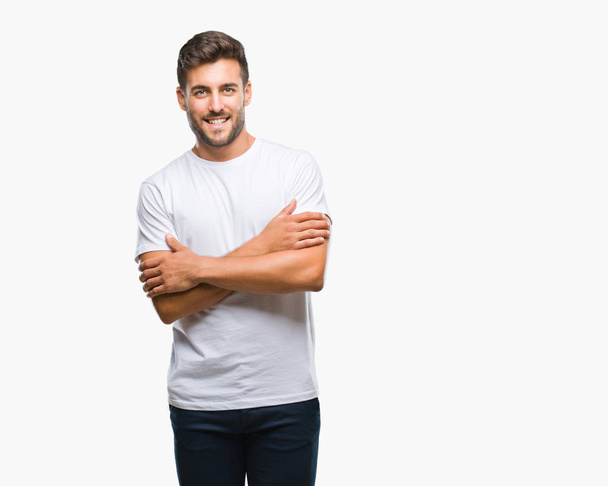 Young handsome man over isolated background happy face smiling with crossed arms looking at the camera. Positive person. - Photo, Image