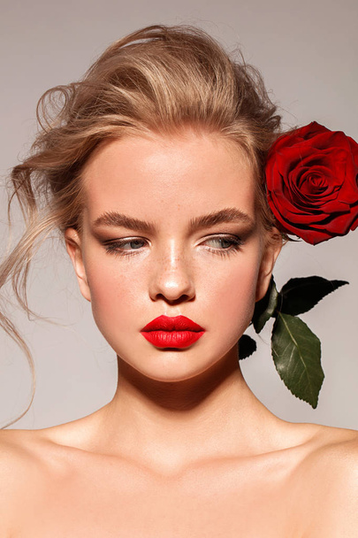 Young girl with red lips and rose. Blonde. Make up. Perfect style. - Fotografie, Obrázek