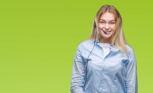 Young caucasian business woman wearing call center headset over isolated background with a happy and cool smile on face. Lucky person. - Foto, immagini