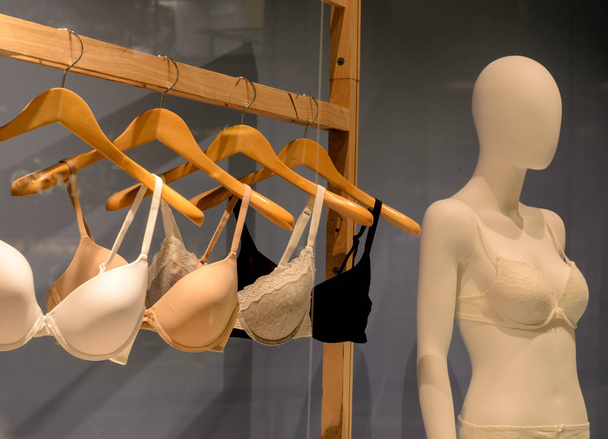 bras on hangers and mannequin for fitting - Фото, зображення