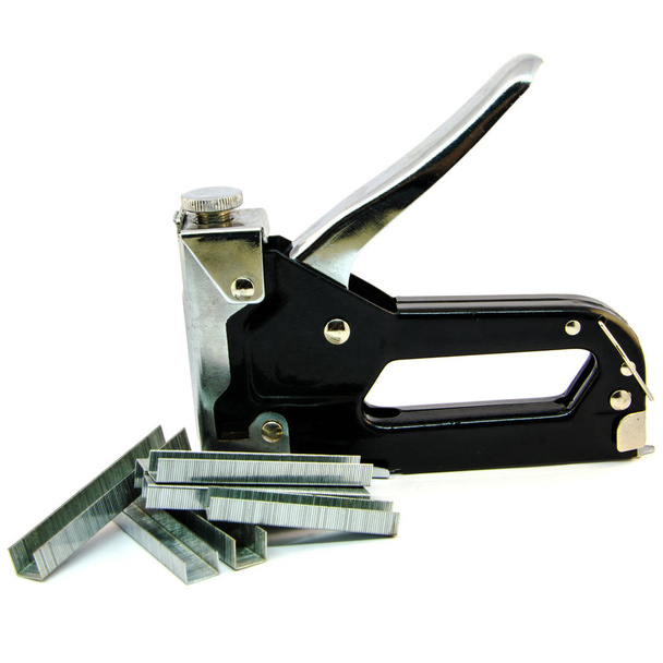 Metal stapler for repair work on the house isolate. Staples to a stapler on a white background. - Photo, Image