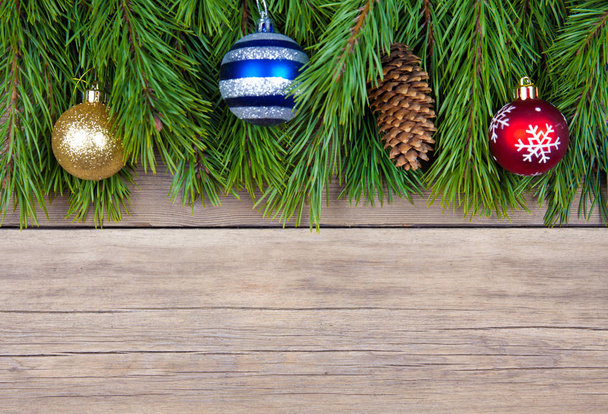 Christmas fir tree with toy on wooden background - Fotoğraf, Görsel