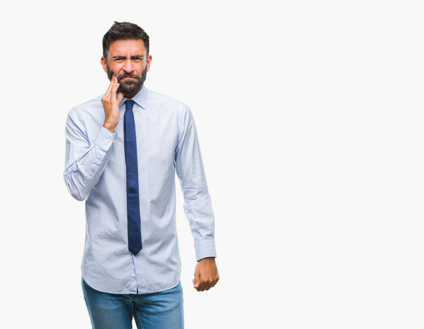 Adult hispanic business man over isolated background touching mouth with hand with painful expression because of toothache or dental illness on teeth. Dentist concept. - Photo, Image