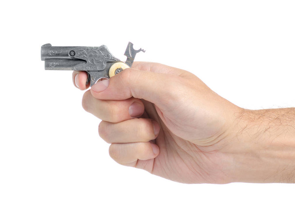 Metal toy gun in hand - Fotó, kép