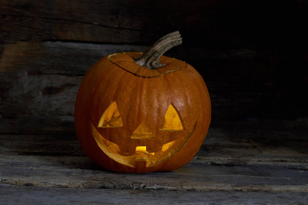 Halloween pumpkin head on wooden background. - Foto, Imagen