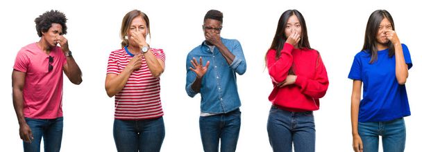 Composition of african american, hispanic and chinese group of people over isolated white background smelling something stinky and disgusting, intolerable smell, holding breath with fingers on nose. Bad smells concept. - Fotoğraf, Görsel