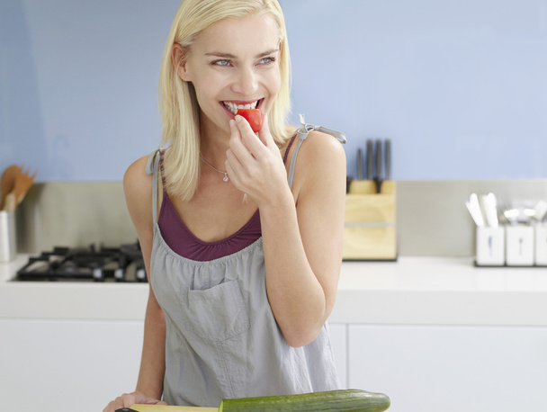Woman Snacking On Cherry Tomato - Фото, зображення