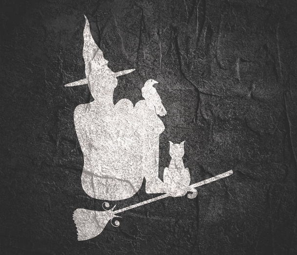 Witch silhouette with a broomstick - Foto, Bild