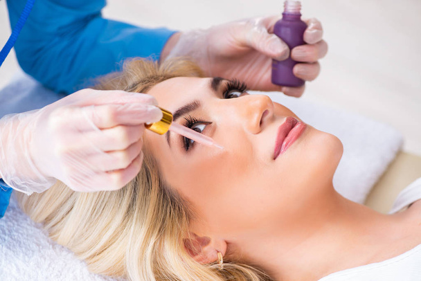 Woman visiting doctor cosmetologyst in beauty concept  - Photo, Image