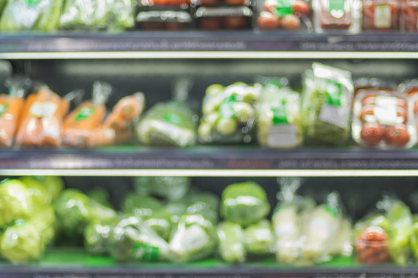 blur background of fresh food in supermarket shelf with bokeh light.grocery product on shelves - Foto, Bild