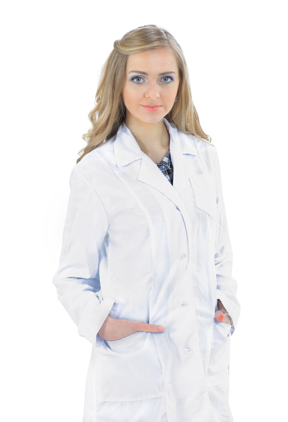 Friendly female doctor smiling - isolated over white background - Photo, image