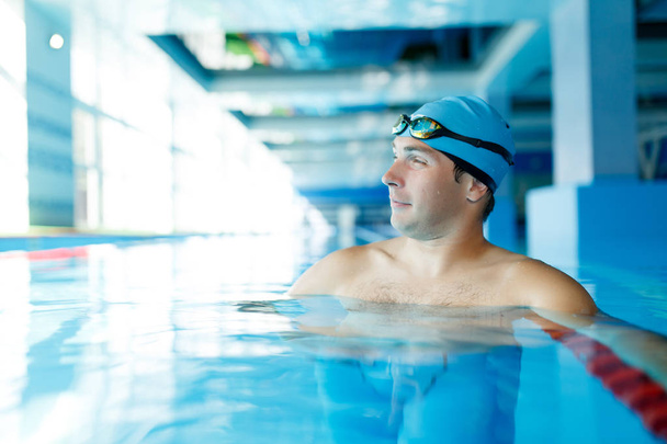 Image of sports swimmer standing in water at pool - Fotó, kép