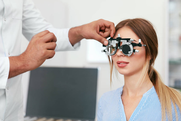 Eye Exam. Woman In Glasses Checking Eyesight At Clinic - Fotó, kép