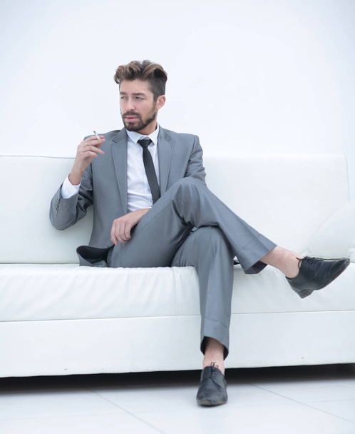 Portrait of a businessman in a suit with a cigarette - Photo, Image