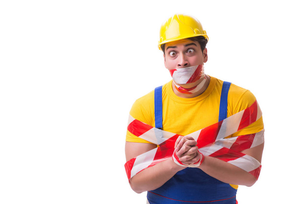 Trabalhador engraçado vestindo macacões com fita - Foto, Imagem